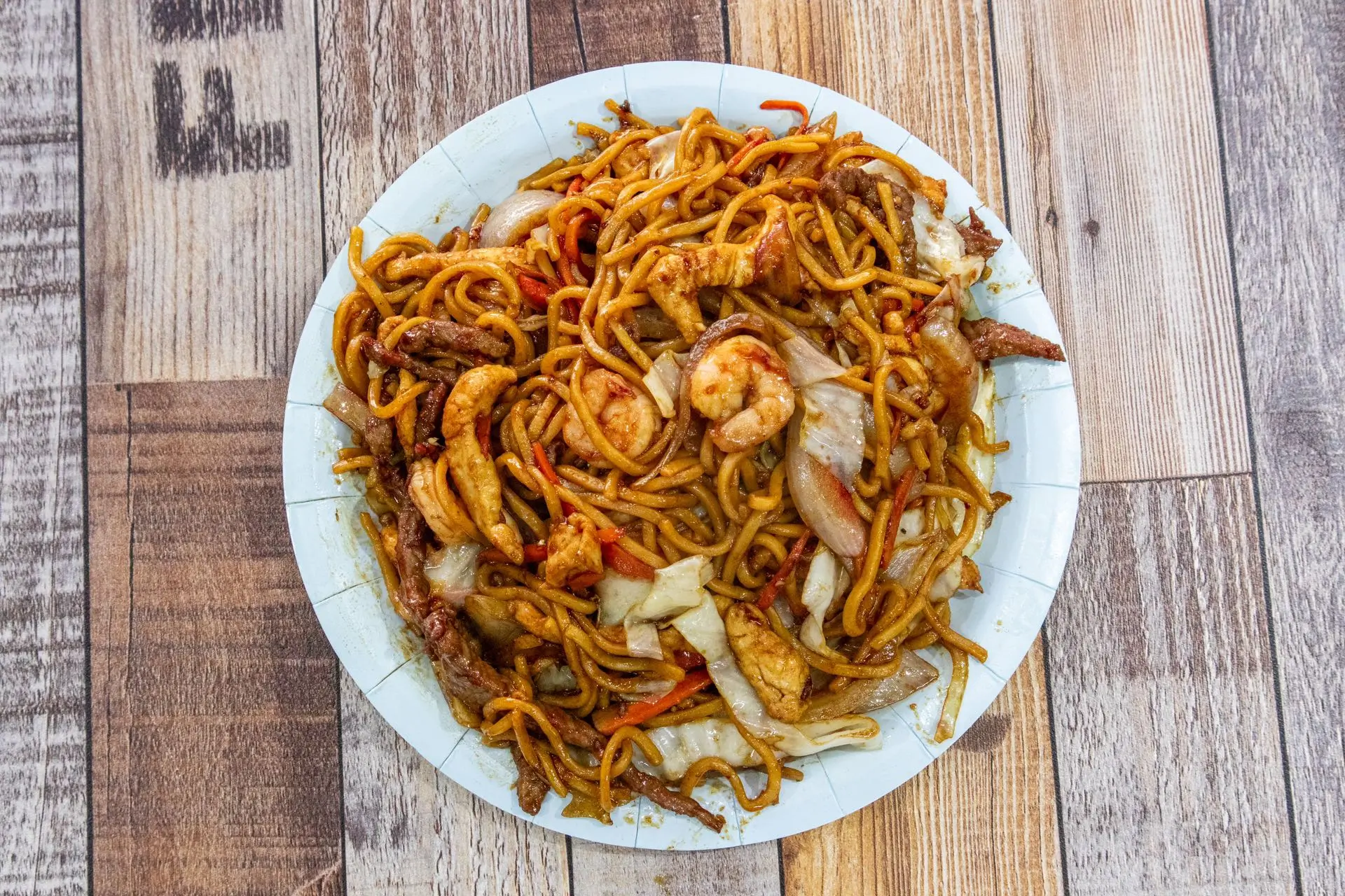 Stir-fried lo mein noodles with beef chicken and shrimp at Aaron Wings & Hibachi, a Hibachi & Wings Restaurant in Stockbridge