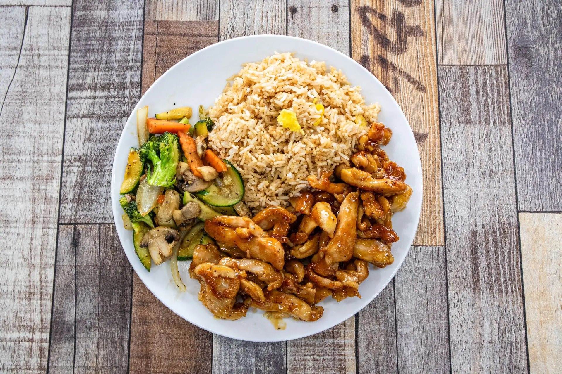 Hibachi chicken dinner with fried rice and mixed veggies at Aaron Wings & Hibachi, a Hibachi & Wings Restaurant in Stockbridge