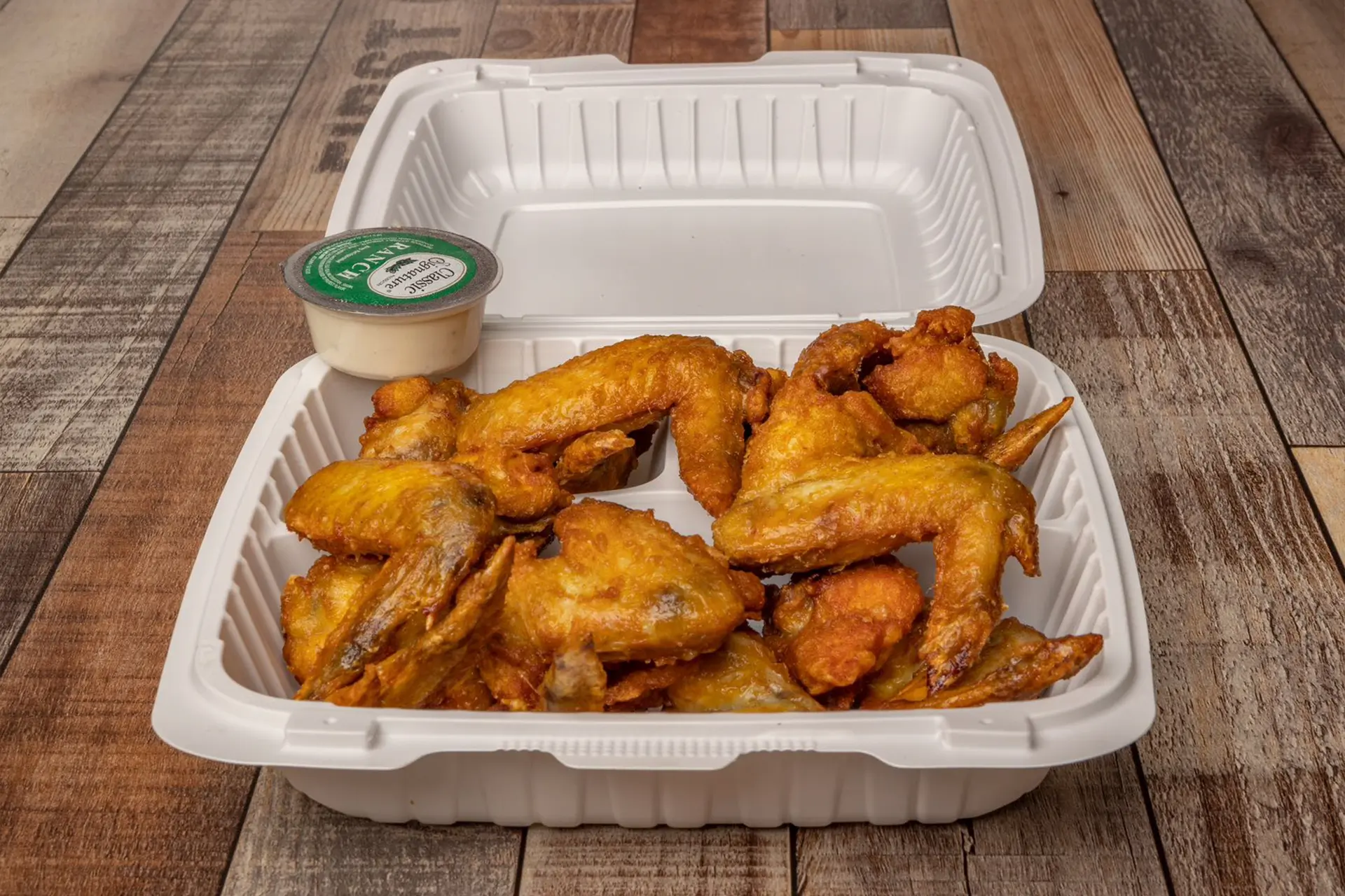 Classic fried chicken wings with ranch dipping sauce at Aaron Wings & Hibachi, a Hibachi & Wings Restaurant in Stockbridge